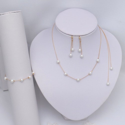 Parure et bijou de dos blanc et or