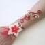 Bracelet mariage rouge champagne + fleur + plumes BRA319
