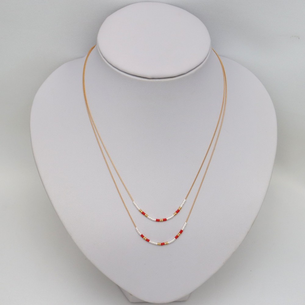 Collier double rang or blanc et rouge Collier double rang or blanc et rouge